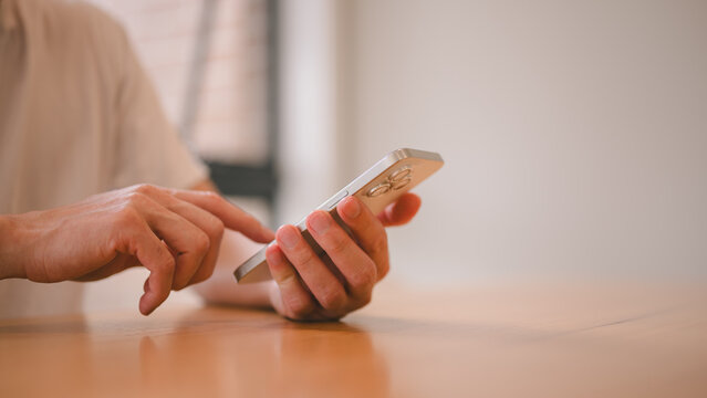 Social media marketing concept. hand using smartphone typing, chatting conversation in chat box icons pop up, Close-up hands of unrecognizable man holding and using smartphone