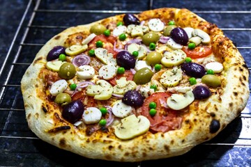 The most authentic Brazilian rustic pizza, with vegetables and ham. Homemade artisanal pizza baked in a wood-fired oven. The most perfect pizza in the world.