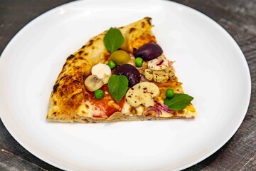 The most authentic Brazilian rustic pizza, with vegetables and ham. Homemade artisanal pizza baked in a wood-fired oven. The most perfect pizza in the world.