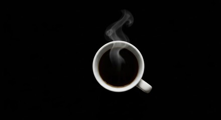 Steaming dark beverage in a white mug, top-down view, isolated on black