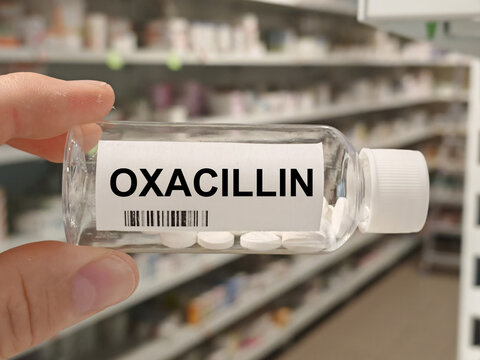 Box of OXACILLIN tablets on a hospital pharmacy table used to treat bacterial infections a penicillin antibiotic.