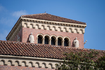 Obraz premium Romanesque brick building with arches and tile roof