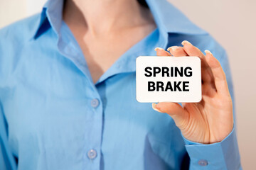 Spring Brake text on notepad, concept background.