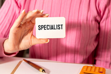 Notepad with Mentor Needed text on a wooden background with felt-tip pens.