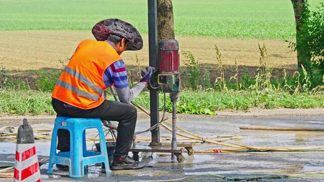 Workers using machinery to maintain the highway