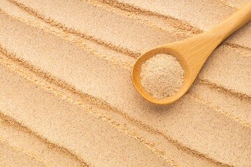 Organic Peruvian maca powder in spoon - Lepidium meyenii.