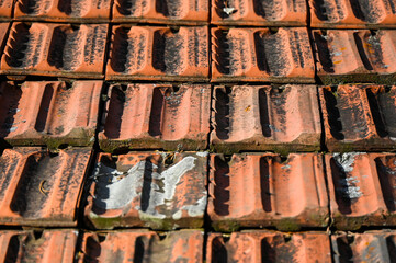 Roof tiles. Red tile on the house, close up.