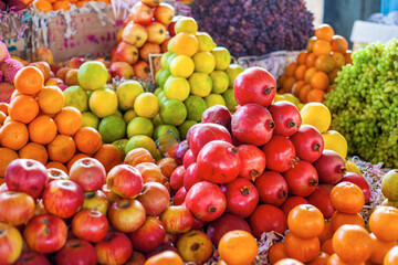 Bright colourful fruits: apples, oranges, grapes ,- on the indian street market