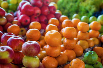 Bright colourful fruits: apples, oranges, grapes ,- on the indian street market