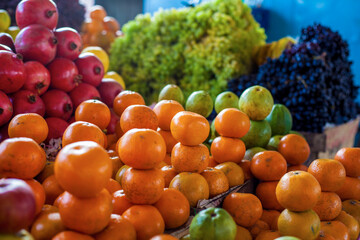 Bright colourful fruits: apples, oranges, grapes ,- on the indian street market