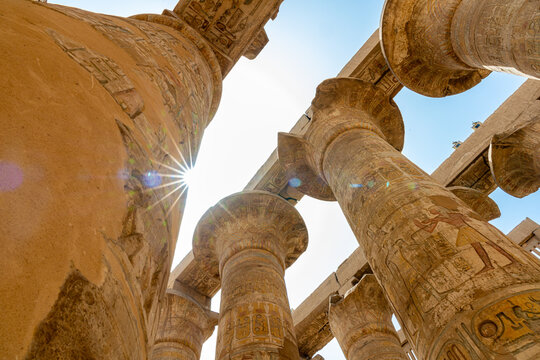Low angle view of massive columns in the Great Hypostyle Hall at Karnak Temple