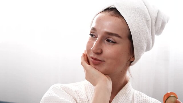  beautiful young woman takes care of her facial skin.
