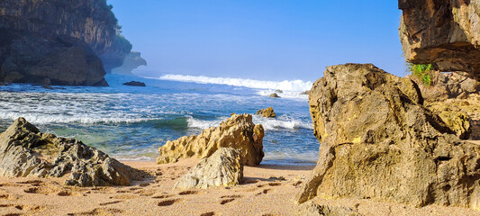 Rocky coast with turquoise water and blue sky, Rocks on the beach. Beautiful Beach	
