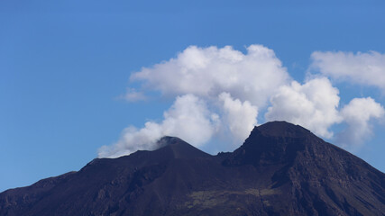 Smoking crest of Stromboli volcano in Sicily Italy
