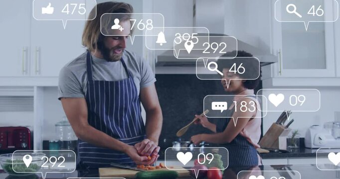 Cooking couple chopping carrots and stirring pot on island with animated icons rising then ebbing
