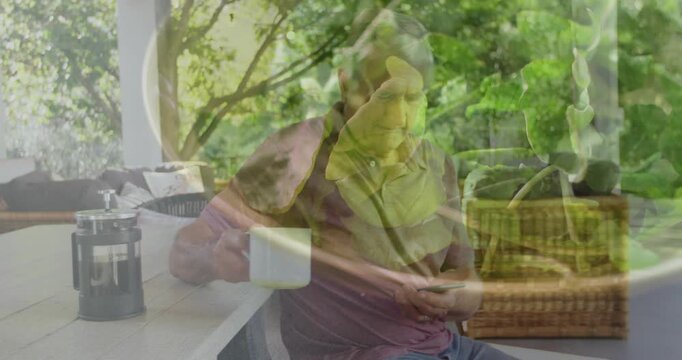 Senior man settling on patio reaching smartphone showing animated icon sipping coffee for tech news - Powered by Adobe