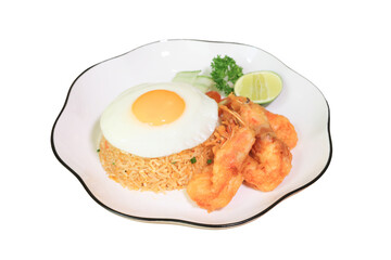 Delicious plate of shrimp fried rice topped with a sunny-side-up egg and a lime wedge. A culinary delight served on a decorative plate