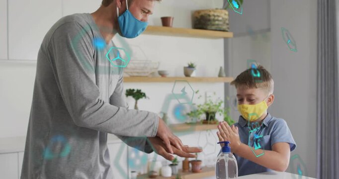 Father guiding son cleaning hands at countertop pumping sanitizer and rubbing with hygiene icons
