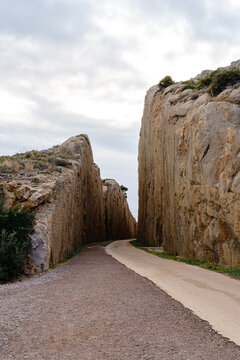  narrow path between cut rock 