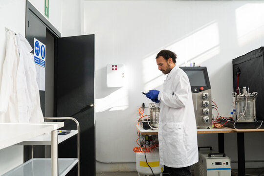  scientist researcher working on biotech laboratory