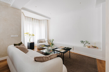 A modern living room filled with natural light