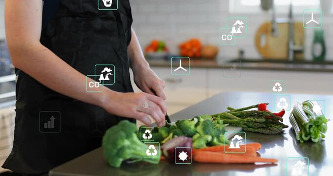 Home cook chopping broccoli initiating floating icons showing sustainable cooking data over produce