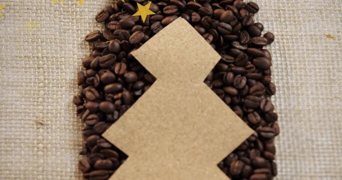 Gold star confetti drifting over corkboard tree as top piece lifting revealing coffee beans