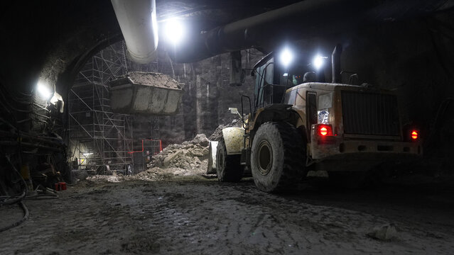 Tunnel Excavation: Wheel Loader and Lifted Muddy Excavation Bucket