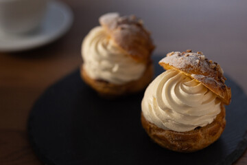Cream puffs in moody lighting with afternoon sunlight