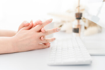 A woman with nails using a computer (work, gel nails, fashion designer)
