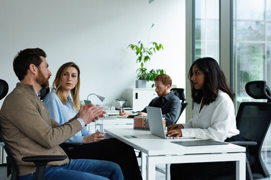Real estate agent and woman client listening client telling to her