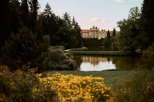 Romantic castle view over garden lake