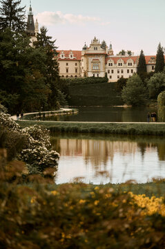 Romantic castle view over garden lake