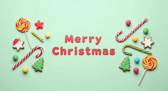 festive Christmas holiday flat lay featuring a Merry Christmas greeting made of letters surrounded by colorful candies and cookies