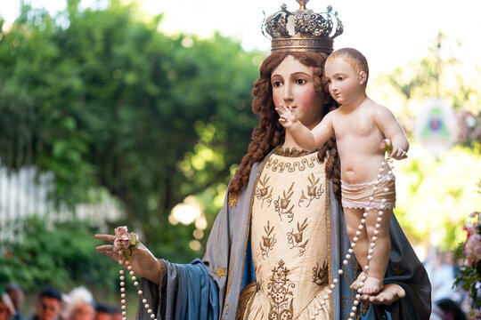 Statue of Virgin Mary With Child During Religious Procession