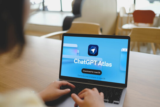 Description: Bangkok, Thailand. November 5, 2025; A person on the download page for ChatGPT Atlas, a new AI application from OpenAI, on a MacBook Pro in a modern cafe.