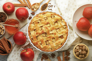 Tasty homemade apple pie and ingredients on white marble table, flat lay