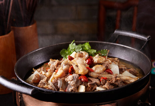 Wok-fried pork ribs and frog meat, close-up