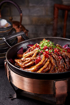 Wok-fried spicy braised duck feet, close-up