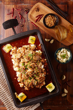 Wok-fried braised frog belly with garlic.