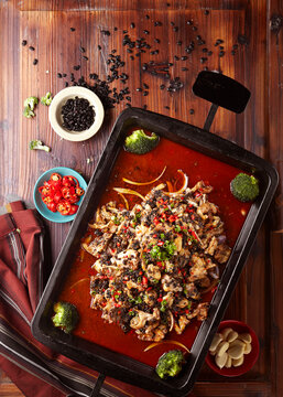 Wok-fried spicy black bean curd with frog meat