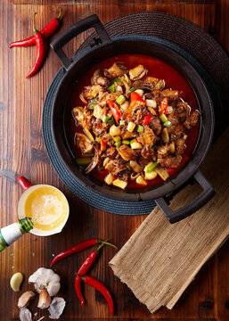 Spicy garlic braised duck in a wok.