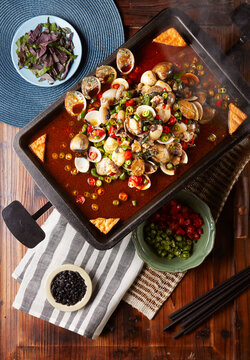Wokfried abalone, flower clams, and baby cuttlefish with spicy perilla