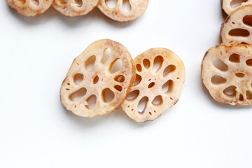 Naklejka premium Fresh lotus root slices, crisp and nutritious.