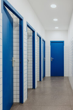 Public restroom with blue doors