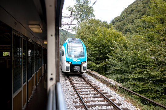 Zagreb, Croatia &ndash; July 18, 2025: A scenic train journey through the Croatian countryside captures parallel tracks winding through lush hills near Zagreb.
