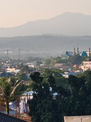Peaceful Cityscape with Distant Mountains
