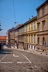 Obraz premium Zagreb, Croatia – July 18, 2025: Historic façades, government buildings, and narrow streets showcase the distinctive architectural character of Zagreb’s Upper and Lower Towns. 