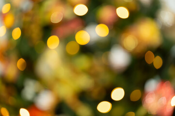 Golden bokeh lights on festive blurred background