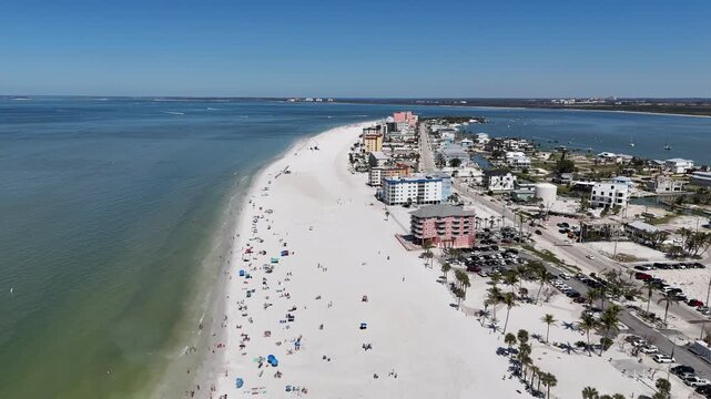 Tourists and locals at the beach near downtown Fort Myers Beach on Estero Island, southwest Florida in Lee County	